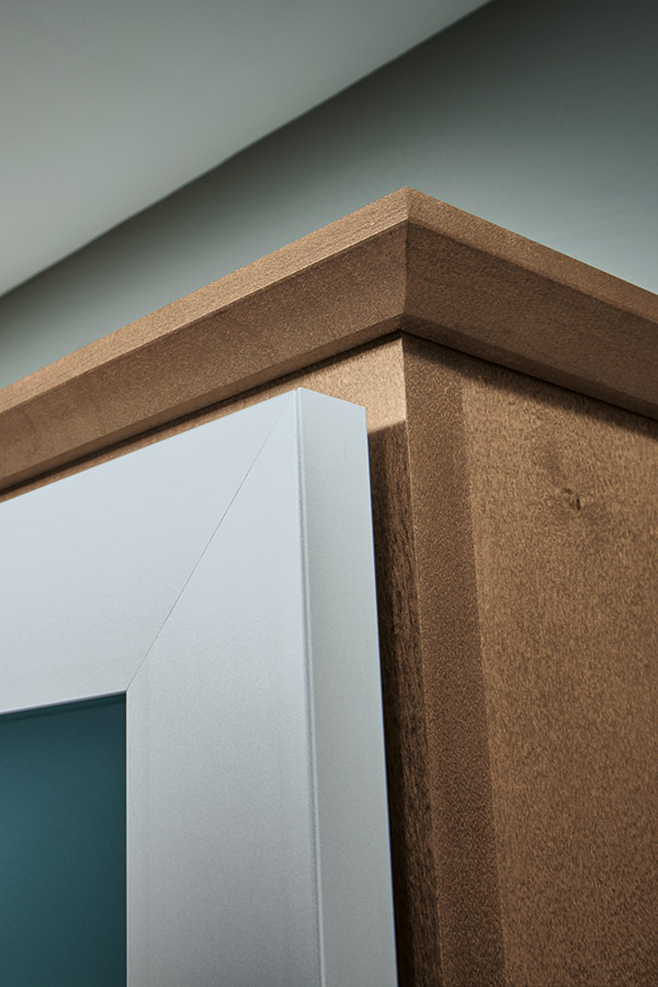 Close-up of cap moulding on Maple kitchen cabinets